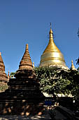 Bagan Myanmar. Next to the Gubyaukgyi stands the gilded Myazedi or 'Emerald Stupa'. 